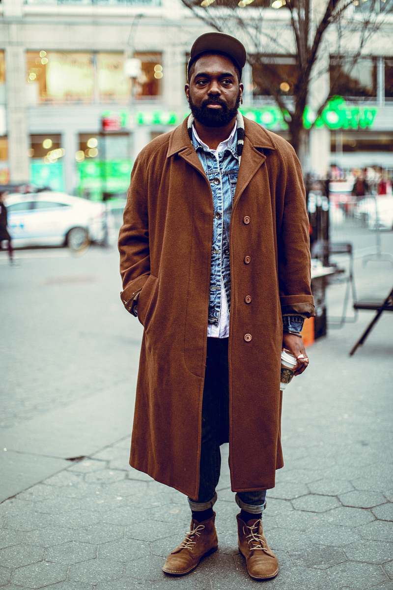 people man standing on road near bare tree coat