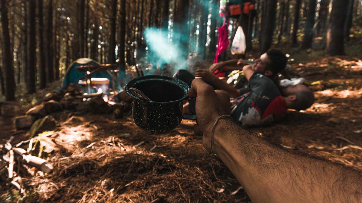 person person holding black ceramic mug people
