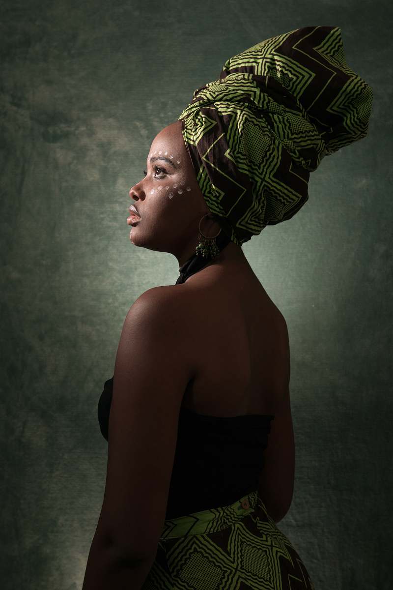 clothing woman in black and green tube-top dress with turban apparel