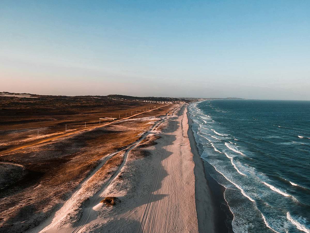 ocean aerial photo of shoreline beside body of water sea