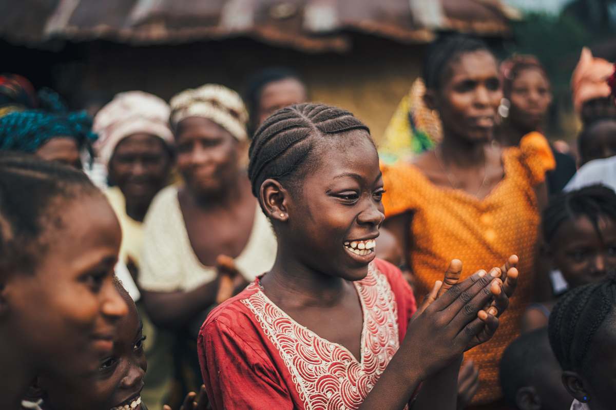 human woman looking at the ground while smiling person