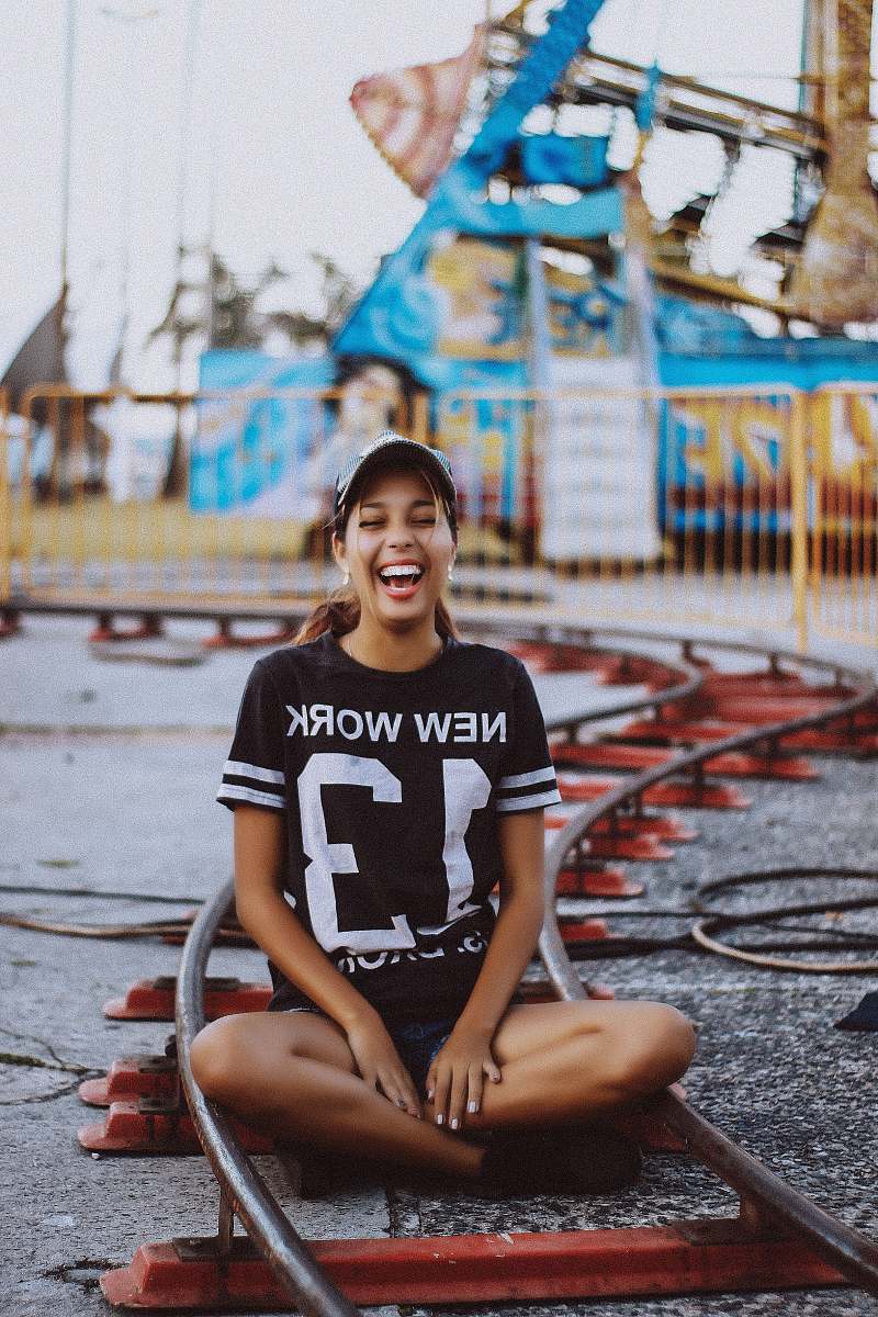 people woman wearing black and white crew-neck t-shirt on carnaval human