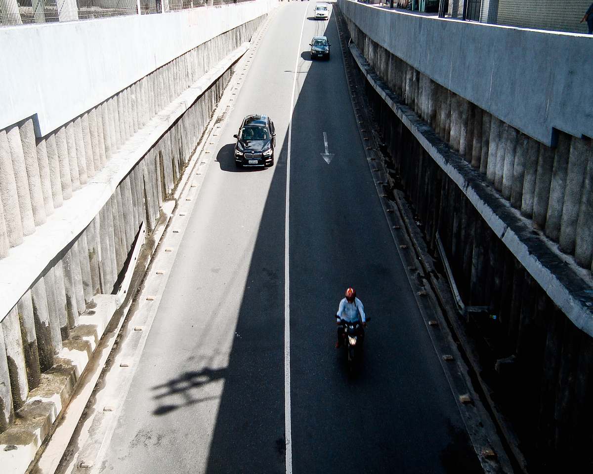 freeway person riding motorcycle in street city