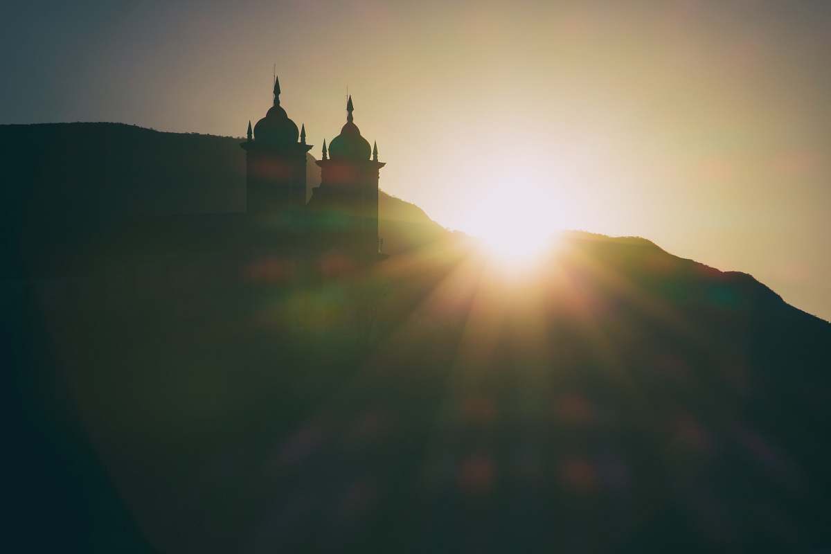 sunset silhouette photo of mosque during golden hour ouro preto