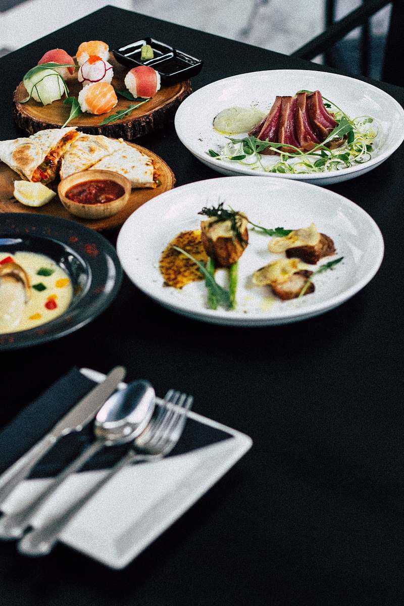 sushi roasted meat served on white ceramic plates meal