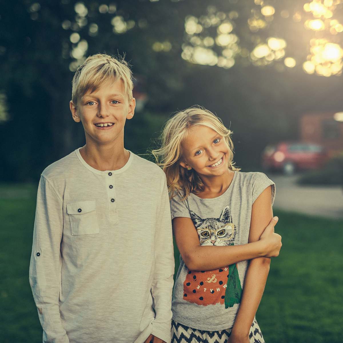 people girl and boy standing on green grass field human