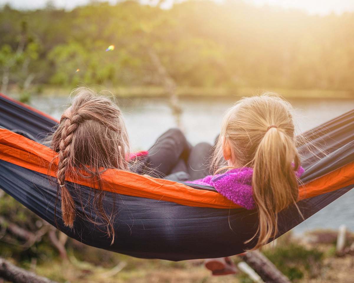 furniture two women lying on hammock hammock