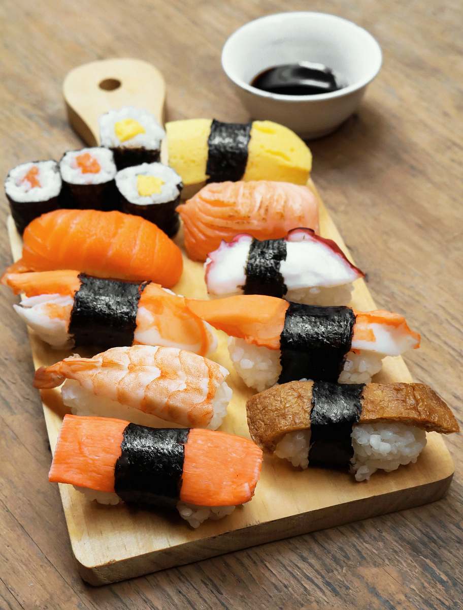 food sushi on wooden platter burger