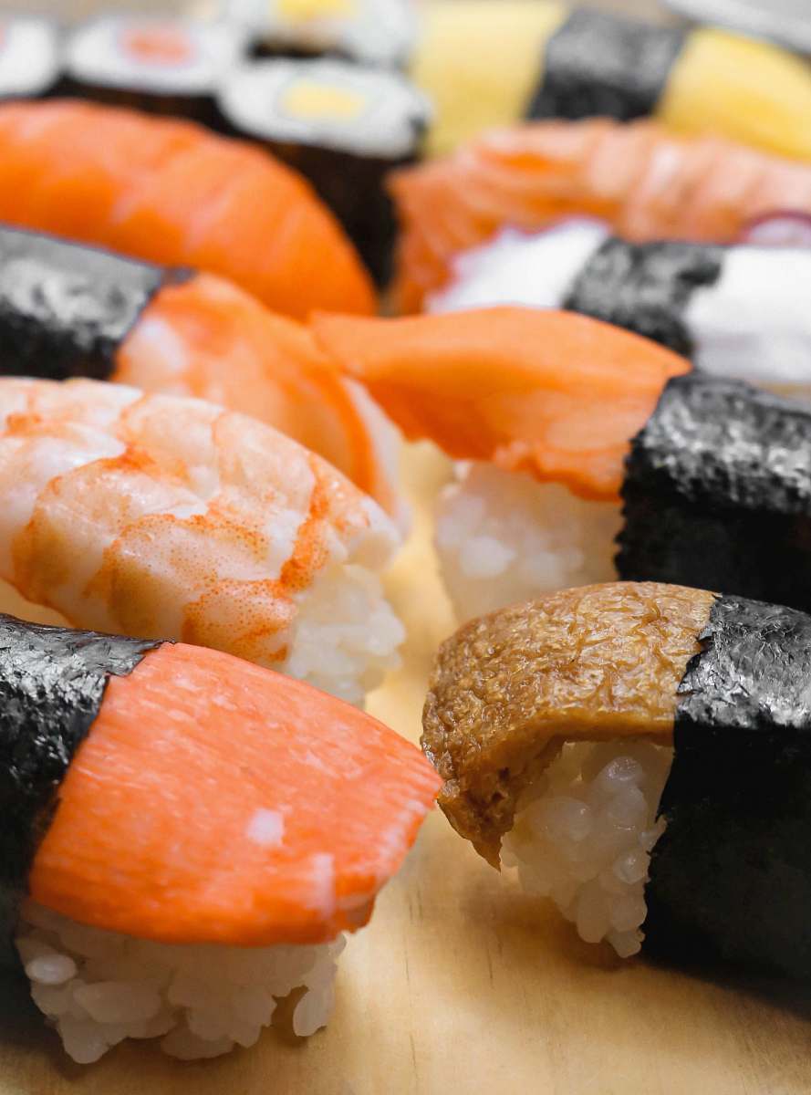 food sushi's on brown surface burger