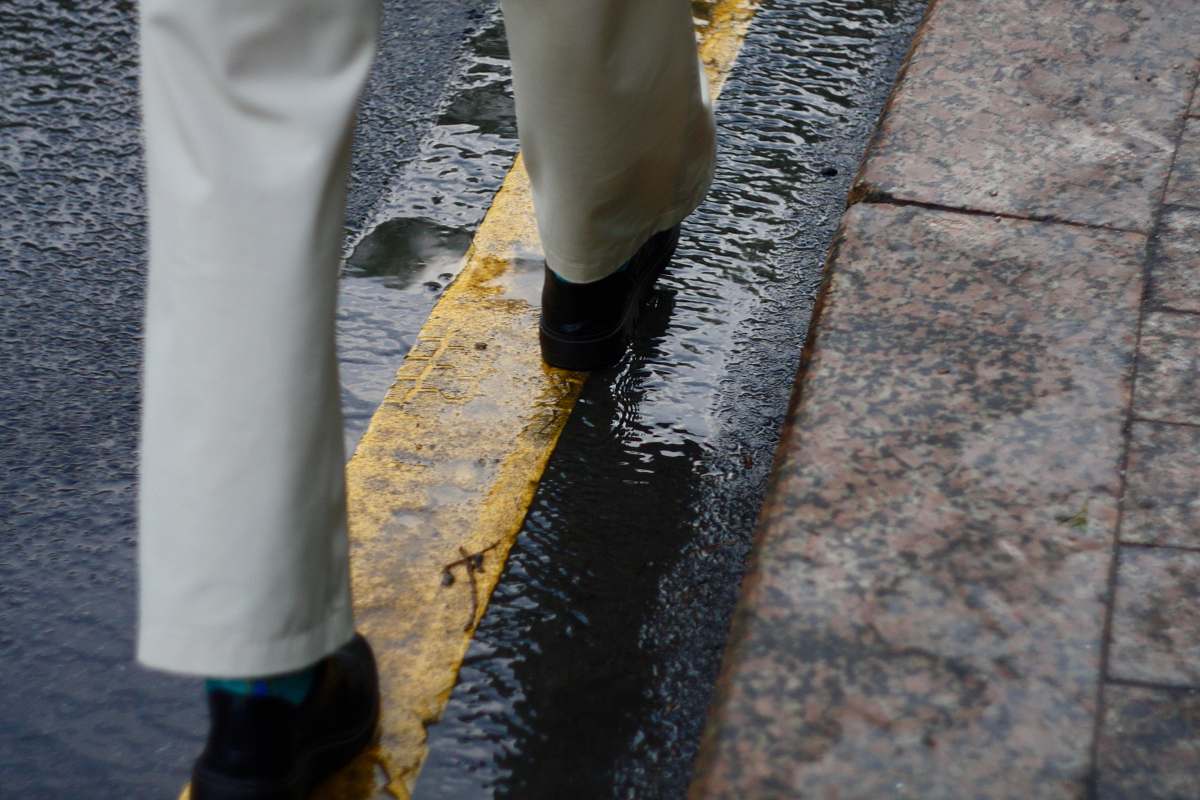 clothing person walking on road footwear
