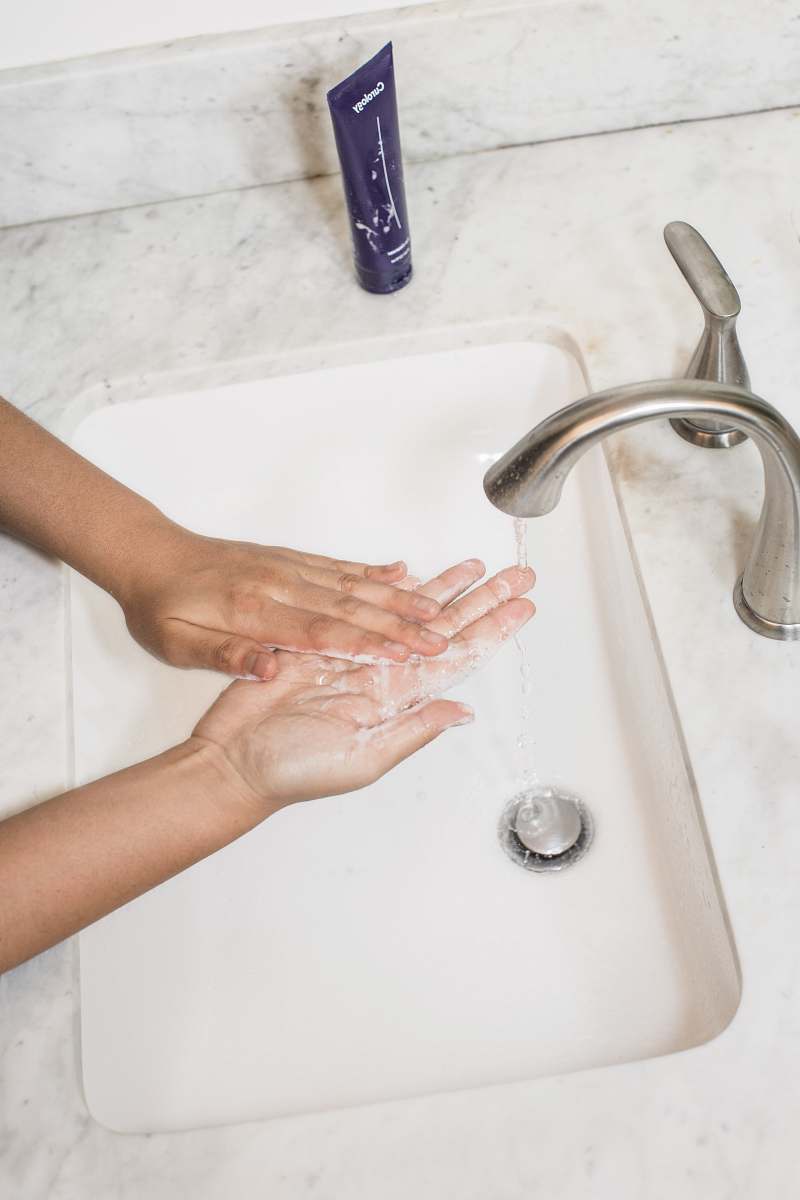 human gray faucet wash