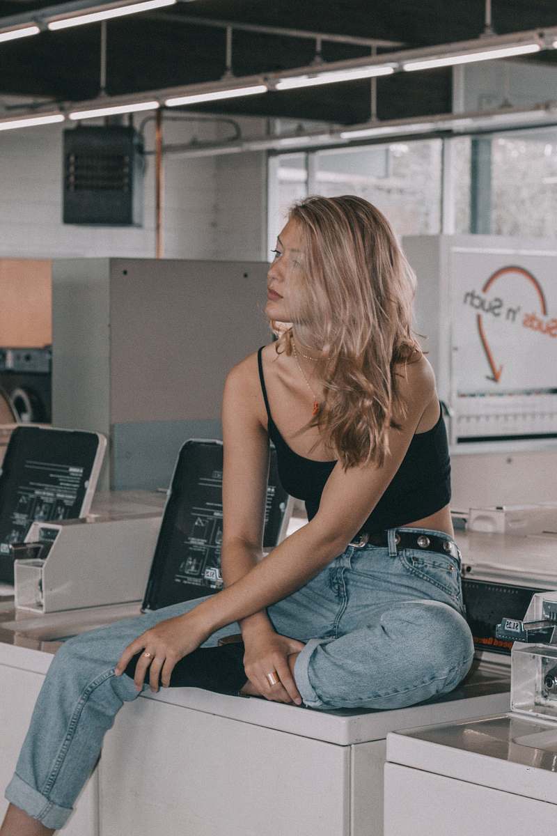 human woman sitting on washer people