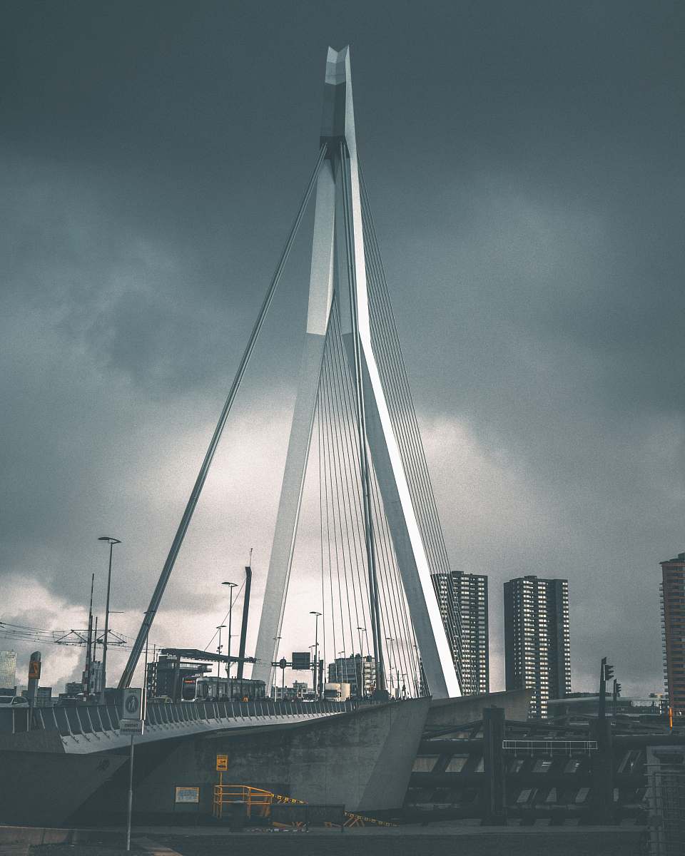 grey gray suspension bridge under gray clouds rotterdam