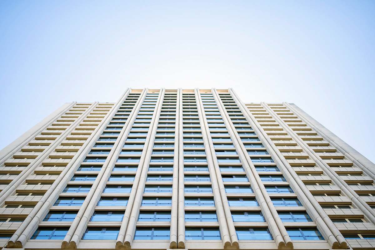 city low angle photography of high rise building during daytime architecture