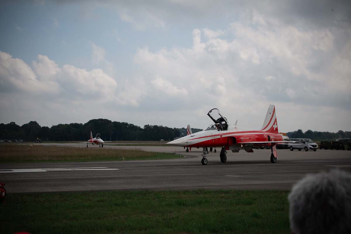 airport red and white jet plane airfield