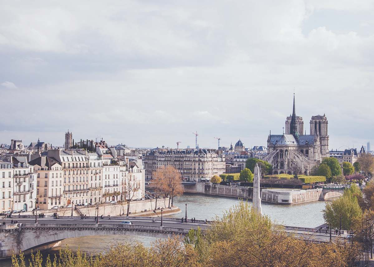 building city scale under white sky at daytime paris