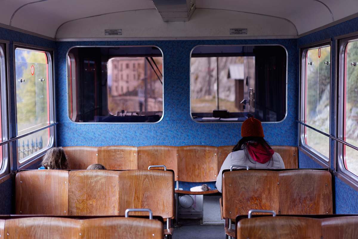 sit person sitting inside the train chamonix