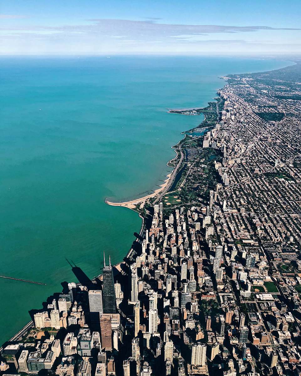 nature aerial photo of buildings near ocean outdoors