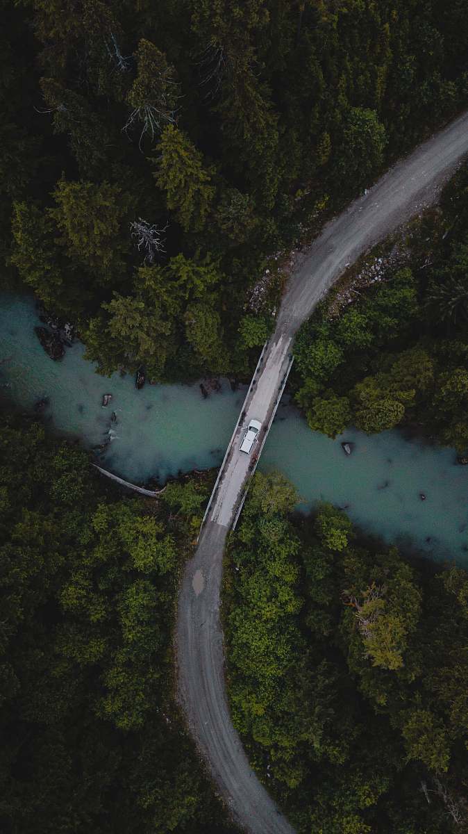 outdoors aerial view of green trees and lake scenery
