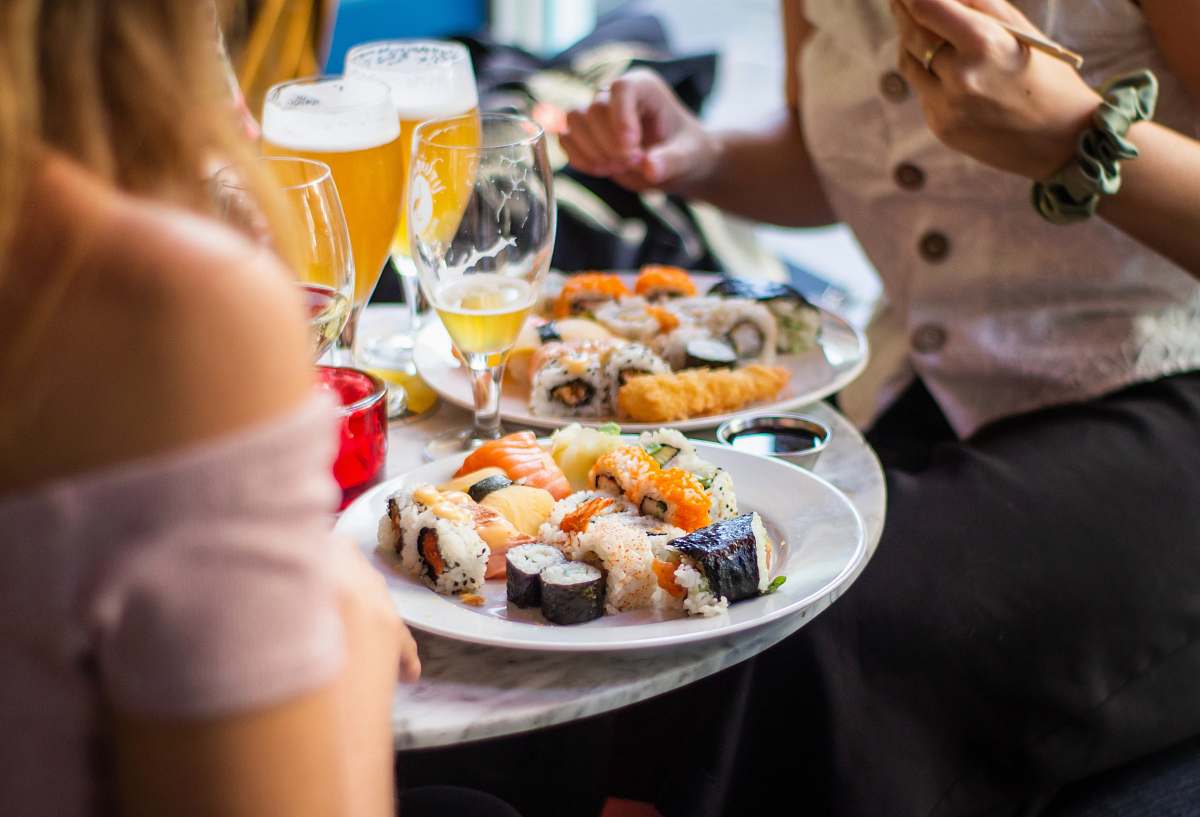 person people near foods on table human