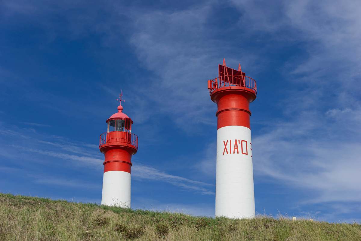 building two white and red towers lighthouse