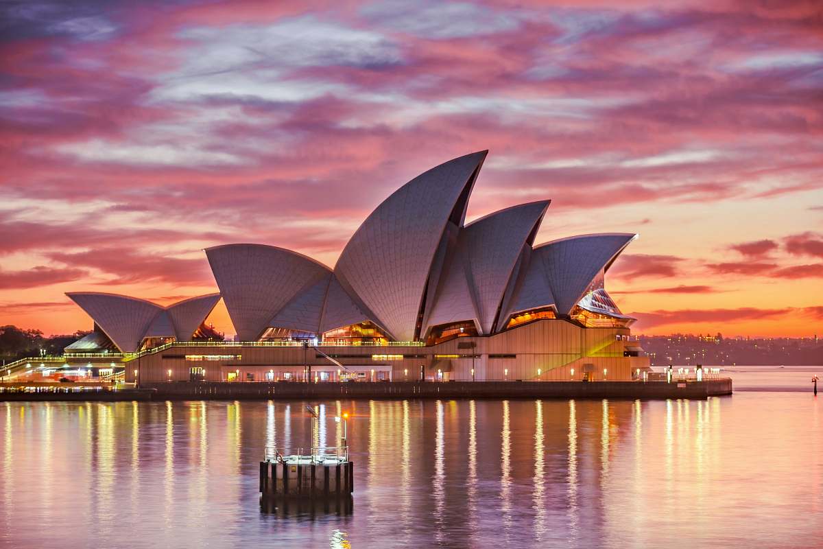 Explore breathtaking architectural photography showcasing the Sydney Opera House, a masterpiece of modern design and a symbol of Australia. This image captures the unique sail-like structure against a vibrant sky, perfect for use in travel blogs, architecture magazines, and promotional materials for cultural events. Ideal for showcasing the beauty of urban landscapes and iconic landmarks.