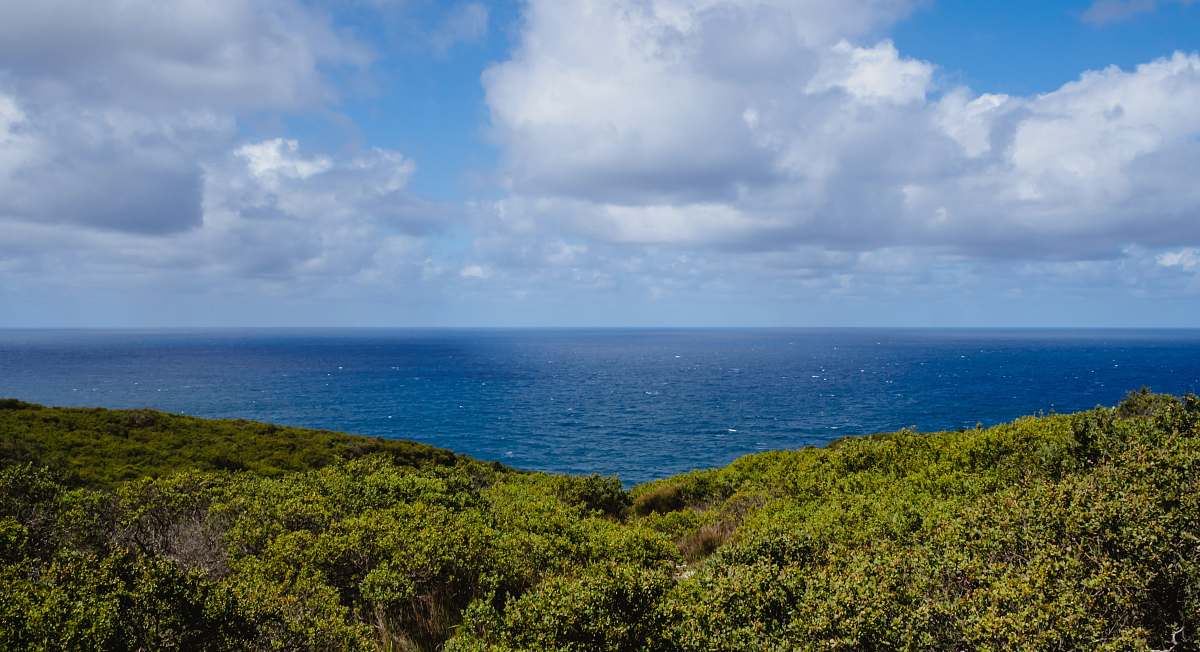 landscape photography of blue ocean under sky sky