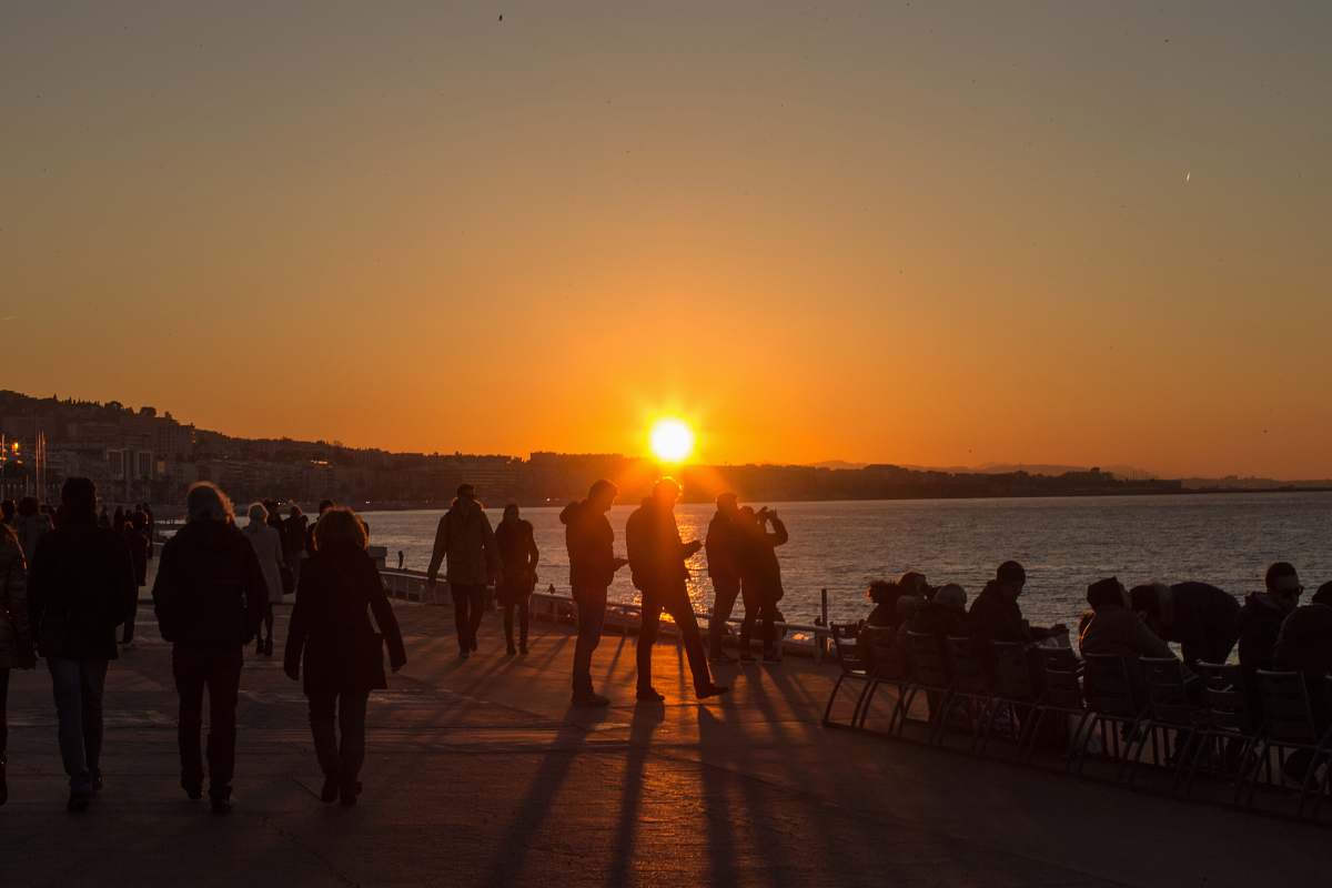 human silhouette of people on seashore person
