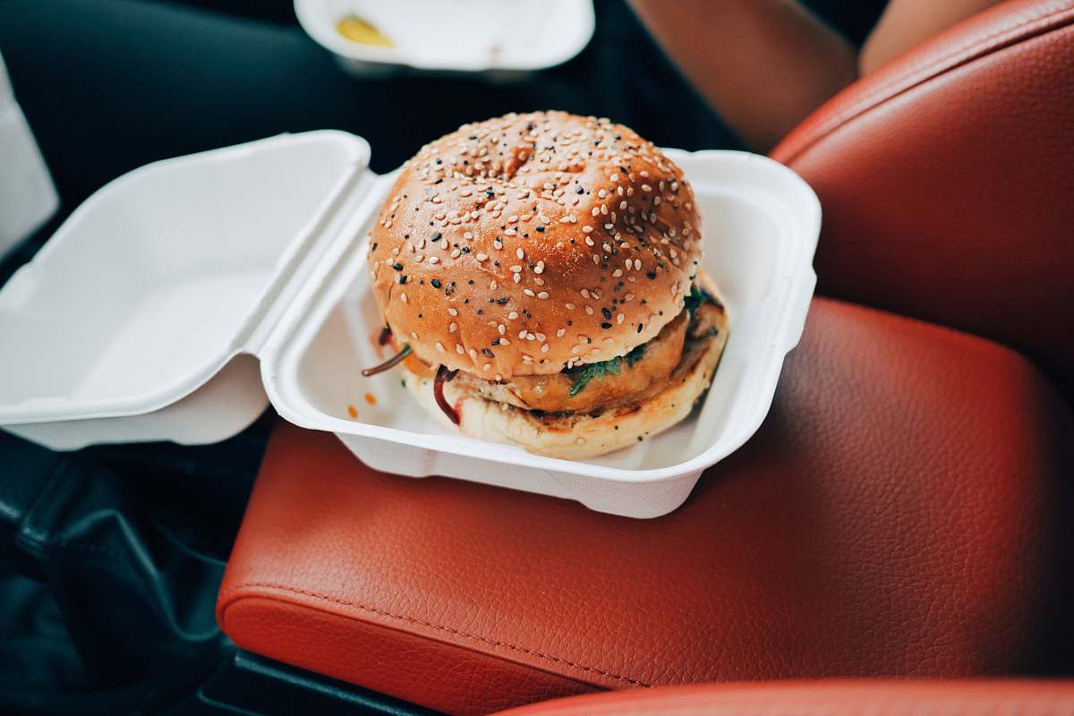 burger burger inside styrofoam container bun