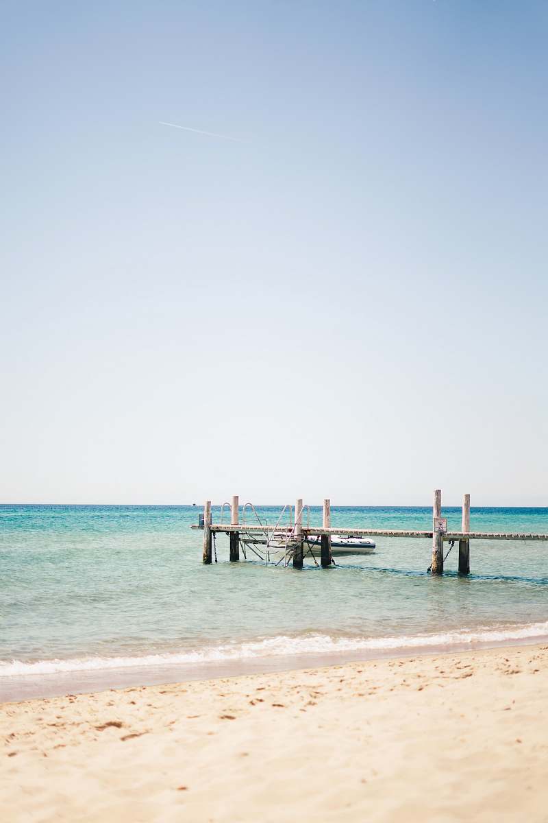 waterfront white and gray wooden dock dock