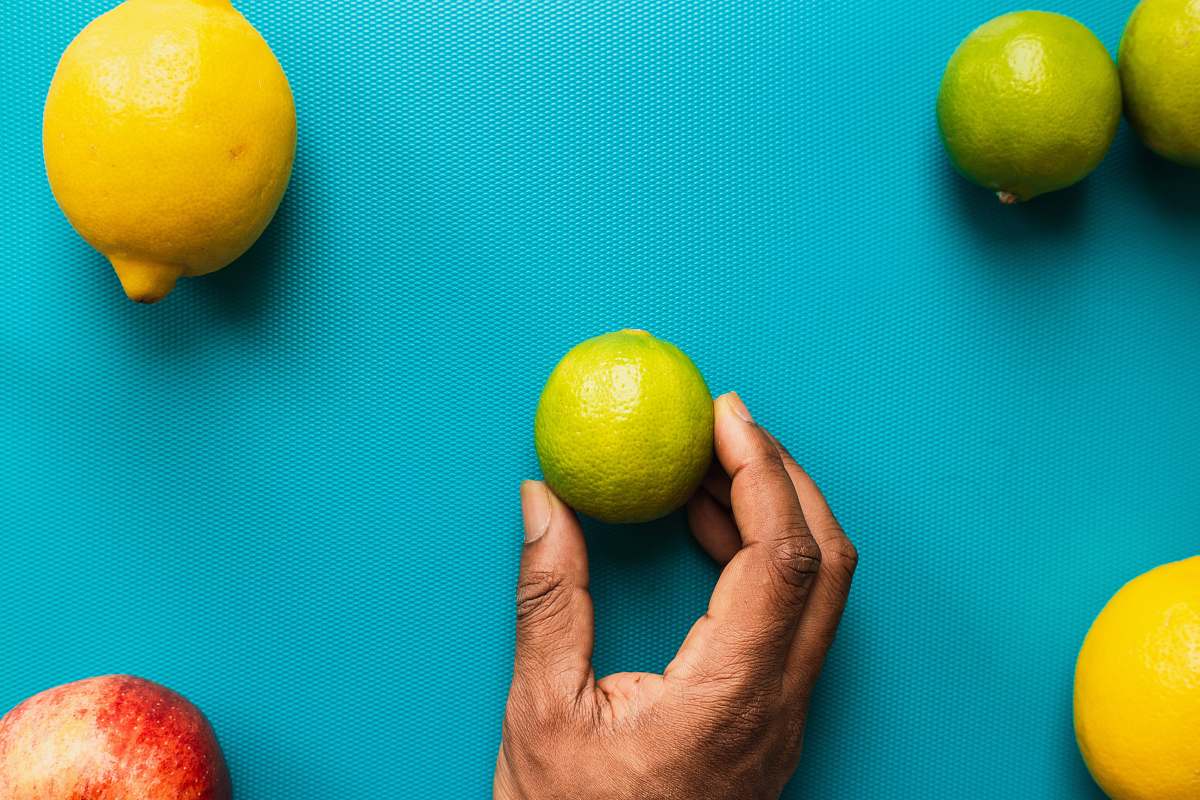 plant person holding yellow lemon fruit citrus fruit