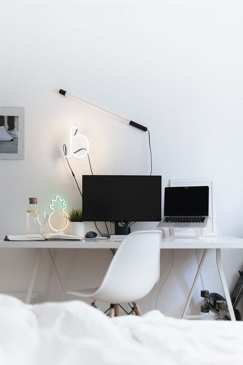 table black flat screen computer monitor on white table desk
