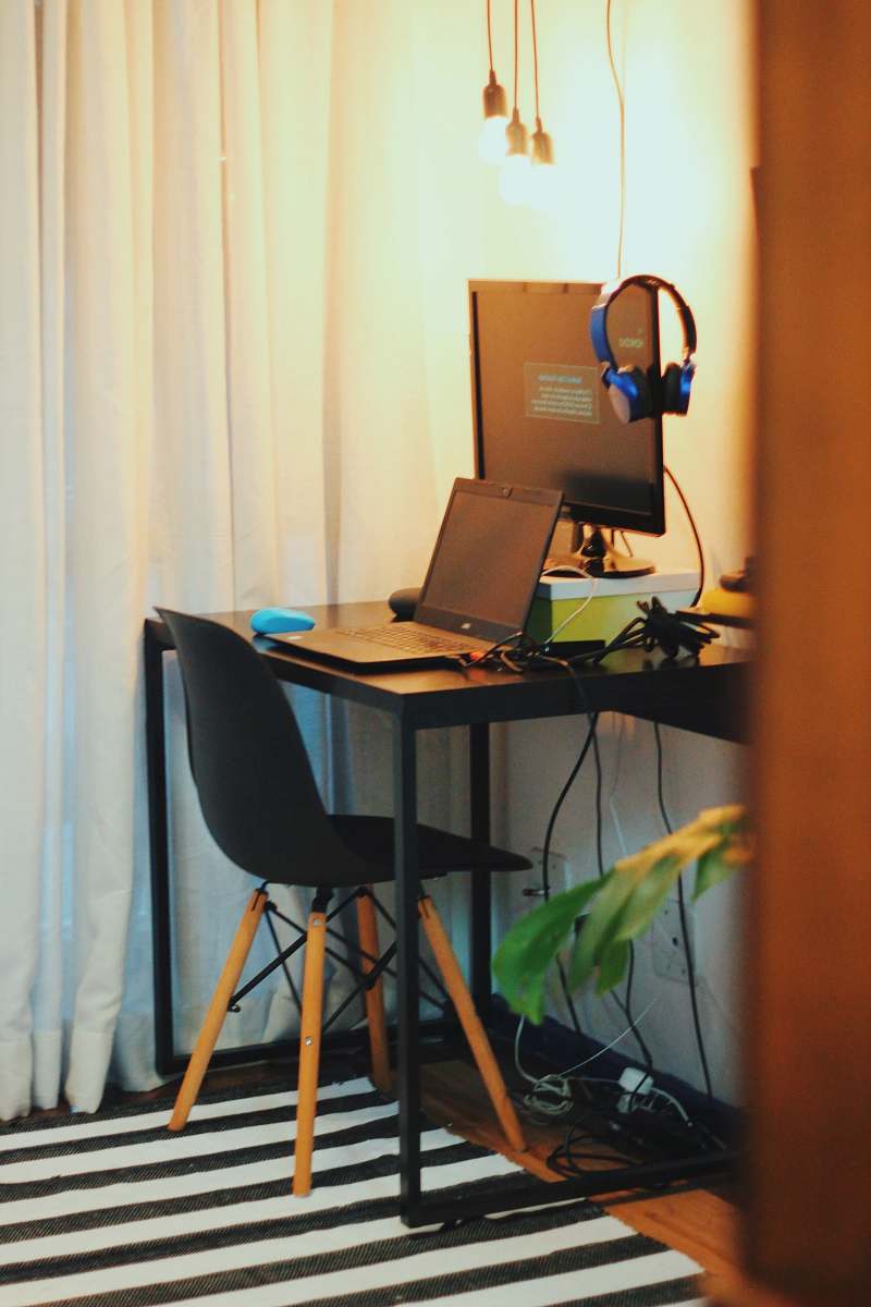 table black wooden office table with laptop and monitor desk