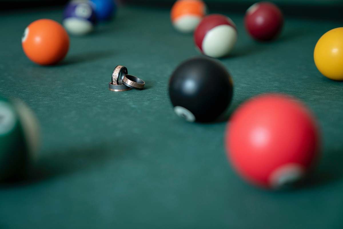 room gold rings surrounded with billiard balls indoors