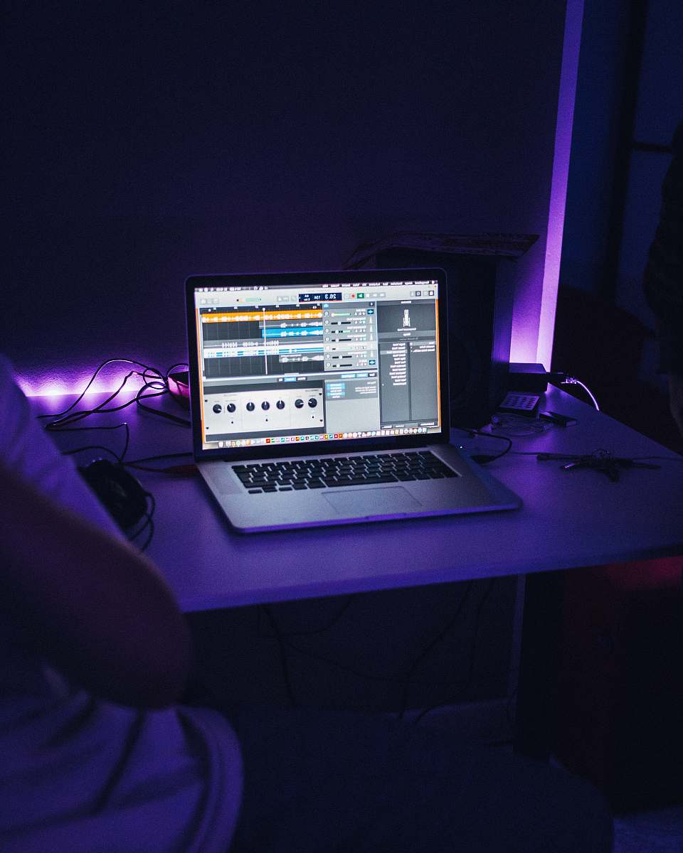 desk MacBook Pro turned on table