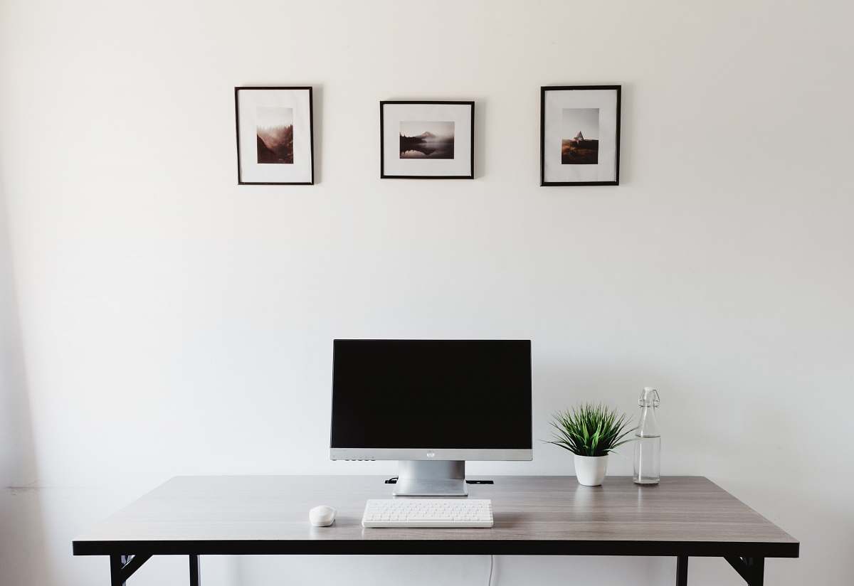 desk monitor, keyboard, and mouse on table table