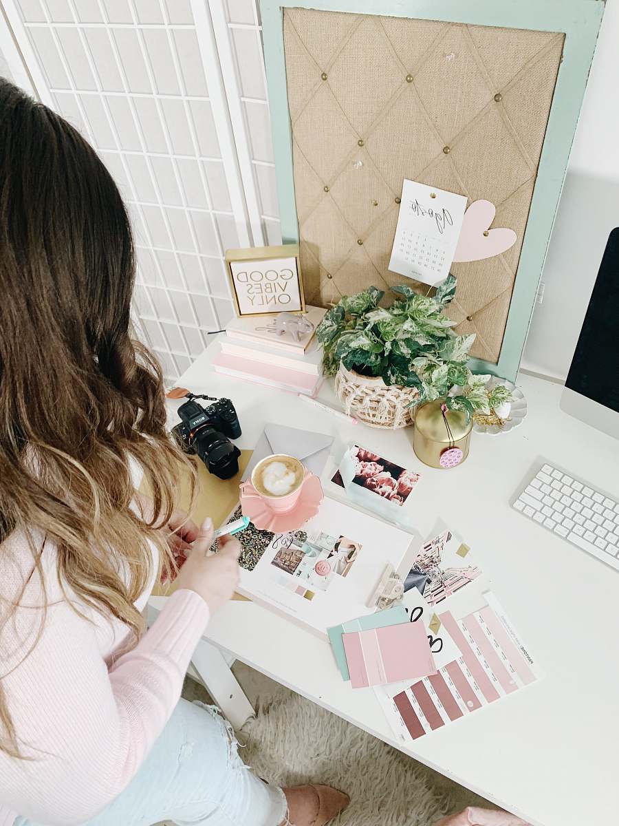 desk pink and white cards and photos table