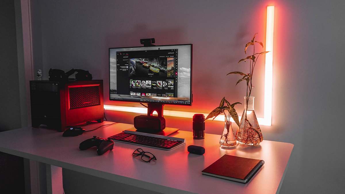 table turned-on flat screen monitor desk