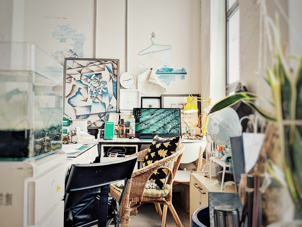 desk turned-on flat screen TV table