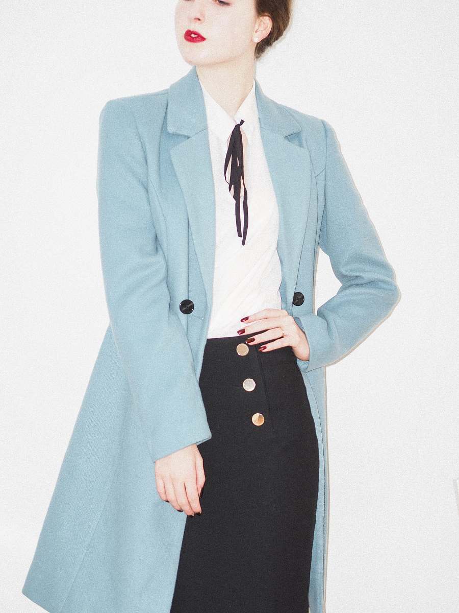 clothing woman in teal blazer and black dress accessories