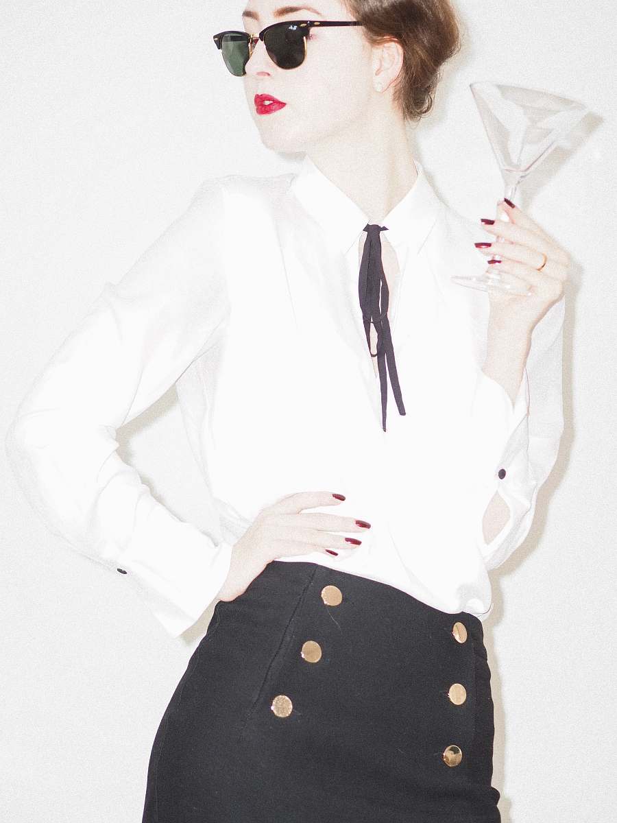 clothing woman in white blazer and black and white polka dot skirt accessories