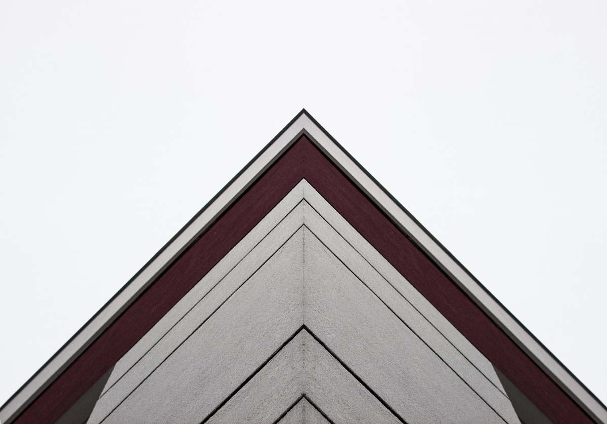 triangle worm's-eye view of white and red building architecture