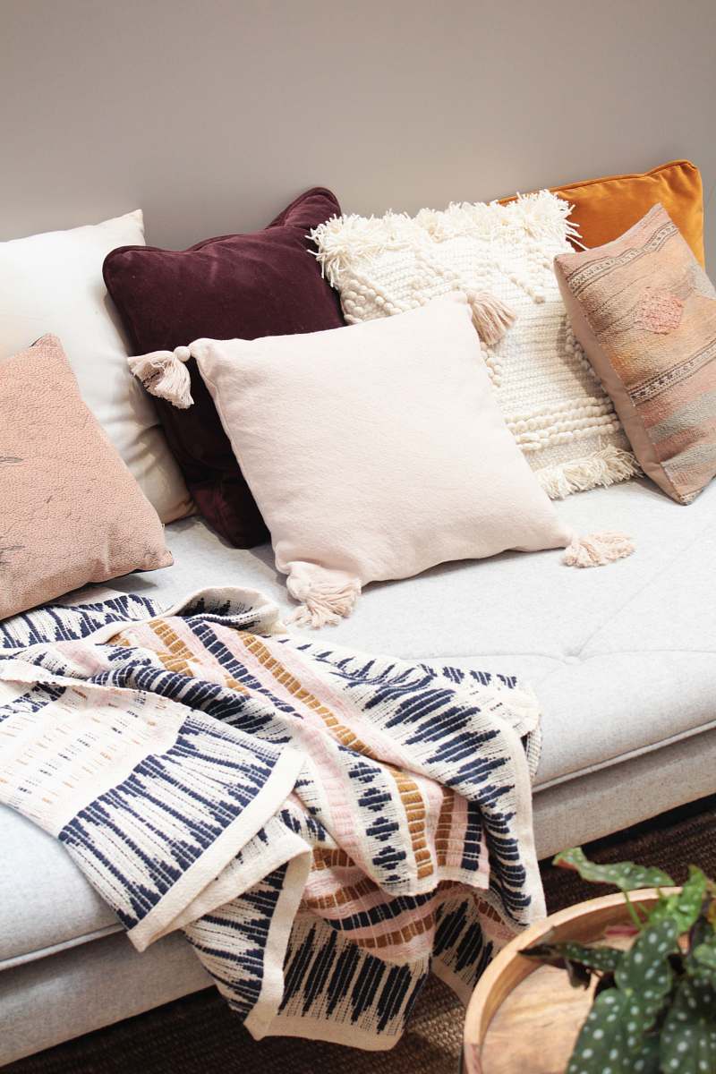 interior assorted throw pillows on gray couch design