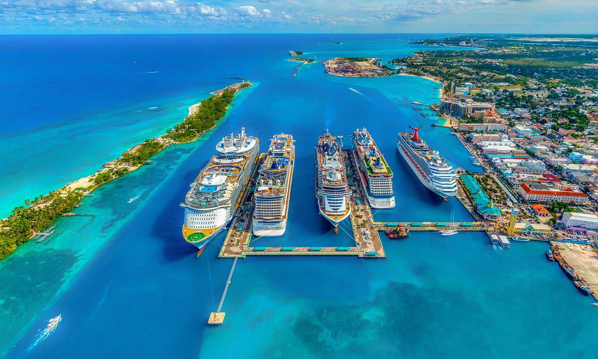 land aerial photography of white and blue cruise ships during daytime nature