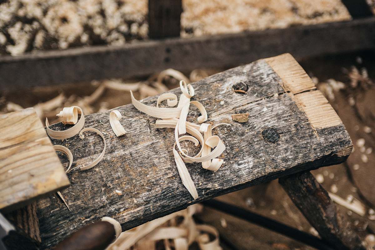 carving selective photography sawdust on plank bowl