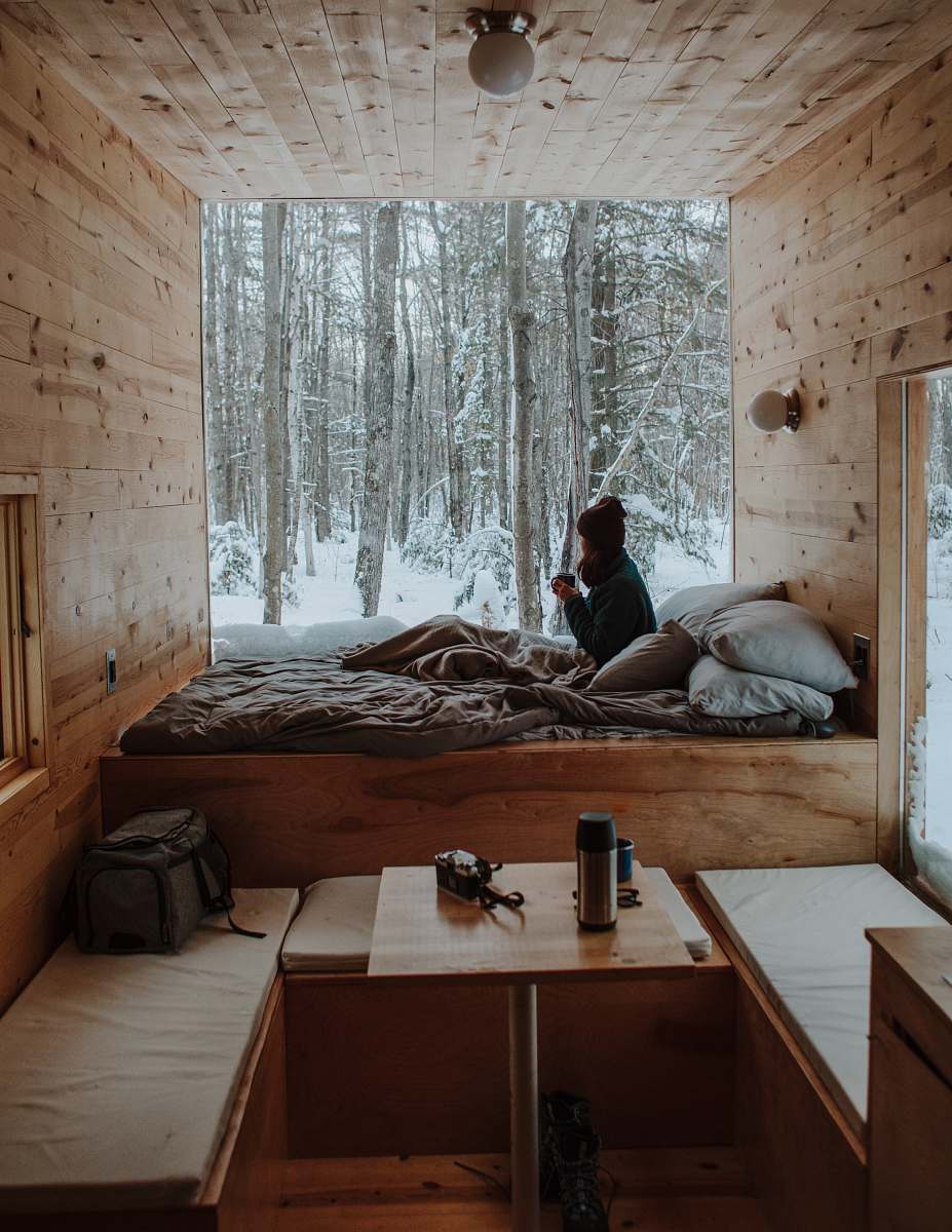 plywood woman sitting on bed watching by the window during winter furniture
