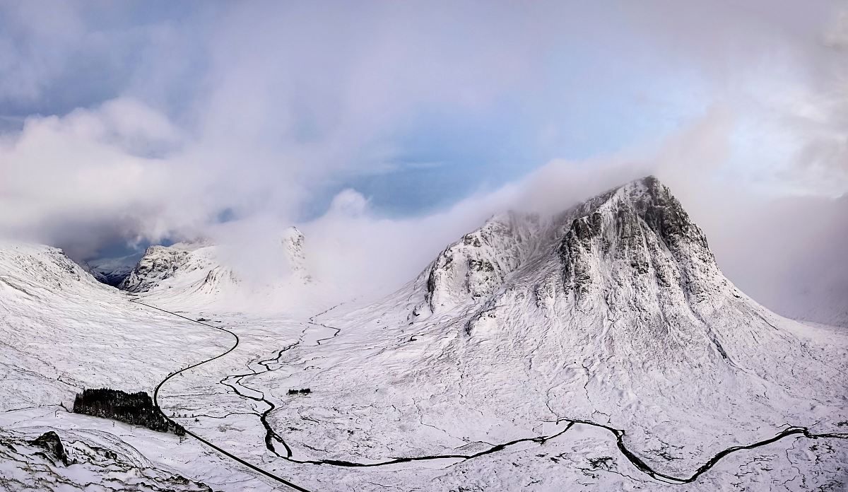landscape photography of snow covered mountain under cloudy sky