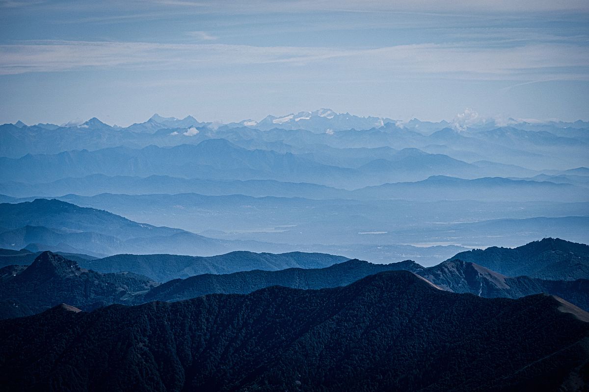 mountains under blue and grey sky