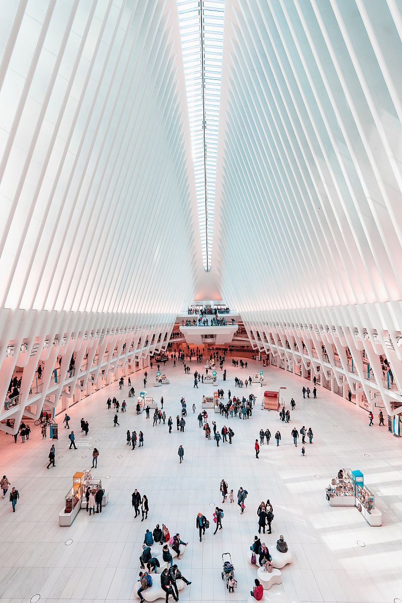 people walking inside high-roofed building