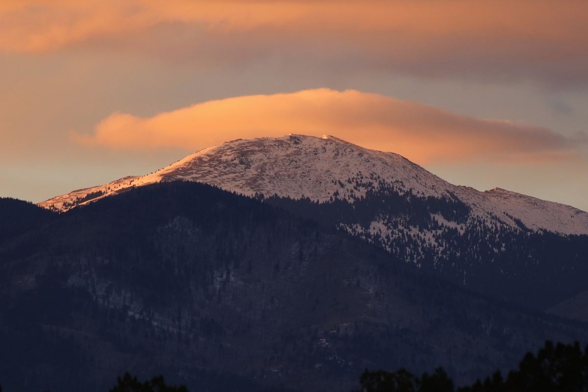 snow covered mountain under white cloudy sky